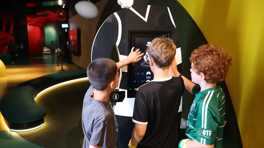 Children play with interactive touchscreen
