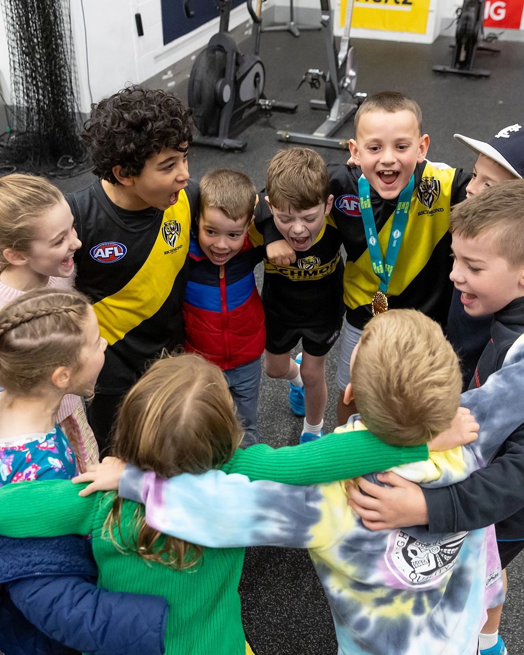 Birthday Parties at the Australian Sports Museum A group of kids sing happy birthday in the player change rooms at the MCG during a birthday party