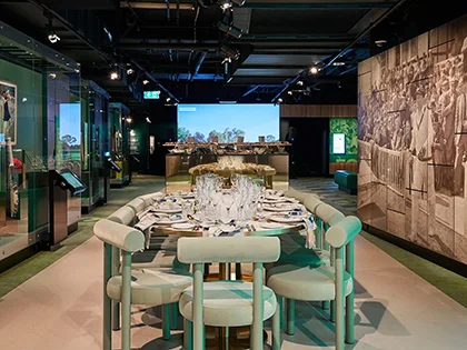 Formal dining setting in a unique museum gallery.