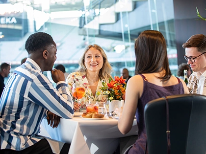 Committee Room by Grossi Dining Package A group of people dine in the Committee Room by Grossi at the MCG