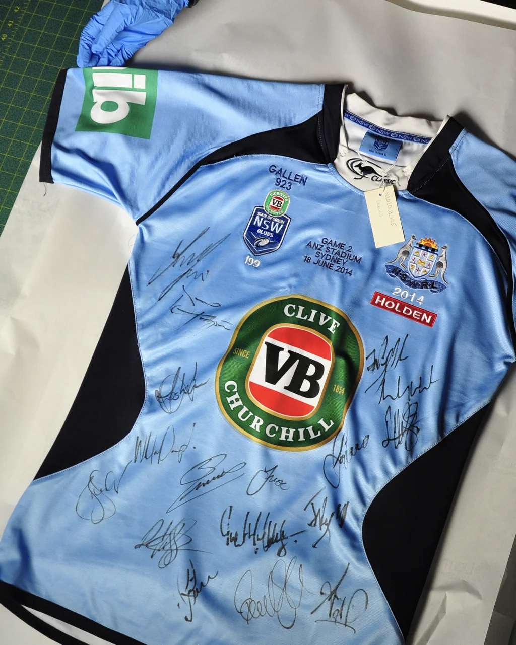 A NSW Blues jersey on a table signed by the team