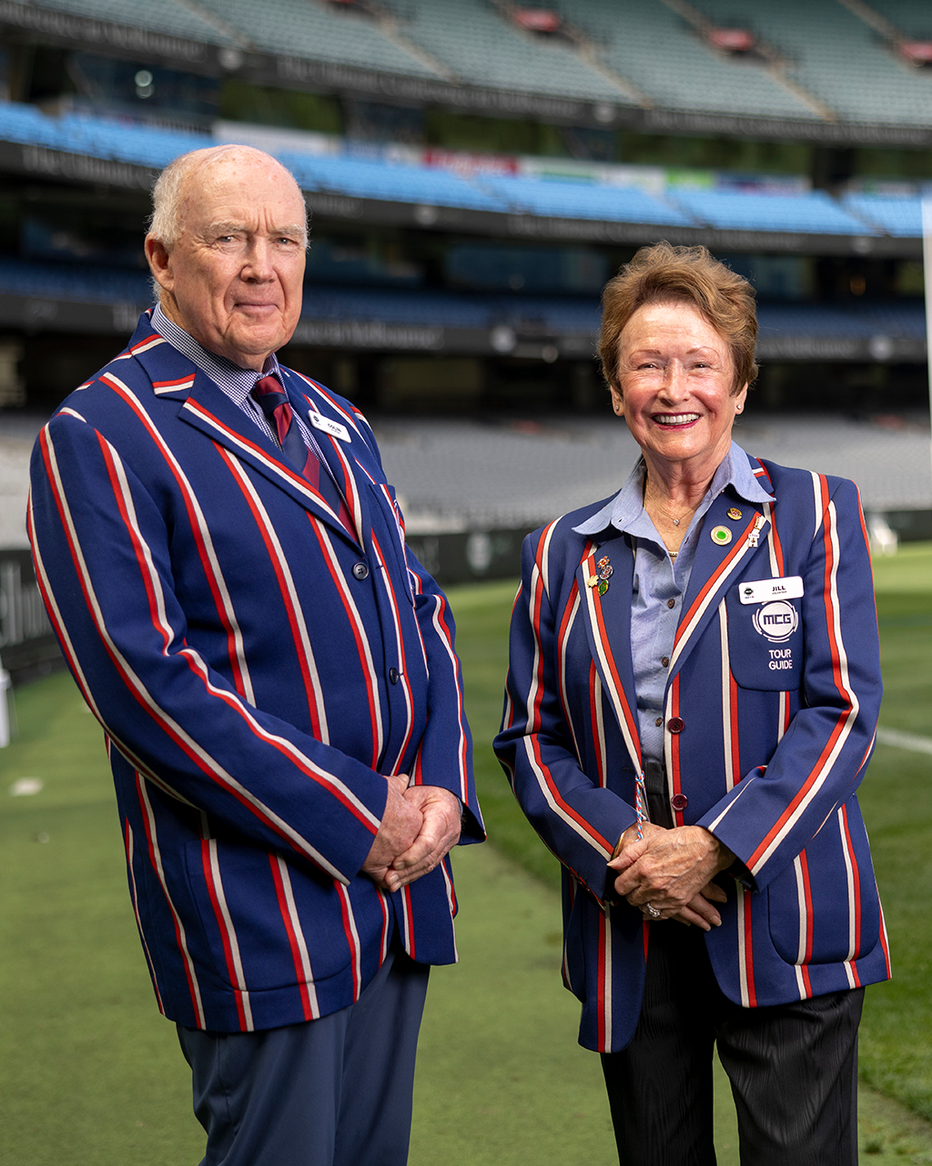 Two MCG Tour Guides stand on the boundary of the MCG