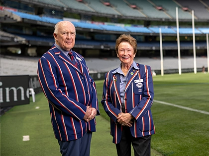 Two MCG Tour Guides stand on the boundary of the MCG