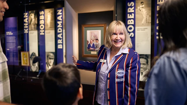 MCG tour guide gestures to cricketing display