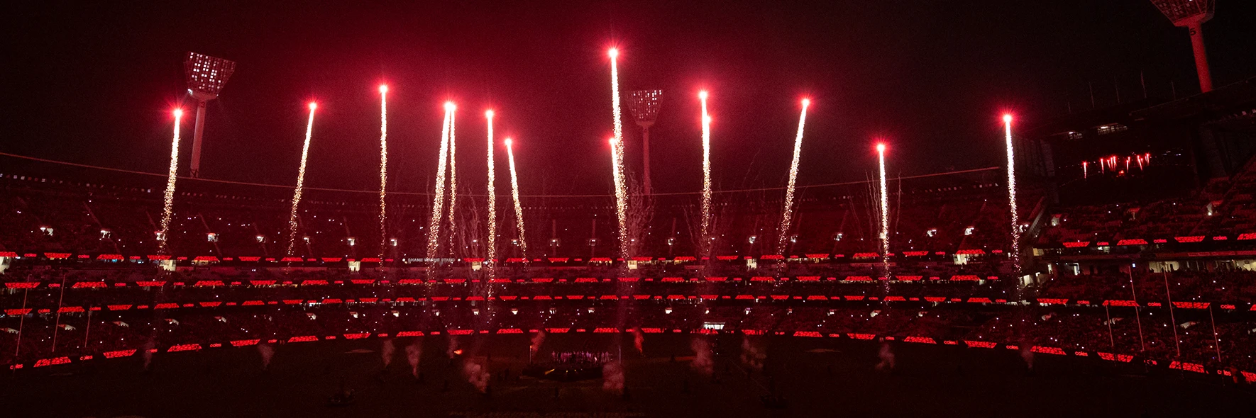 Fireworks light up the MCG in red
