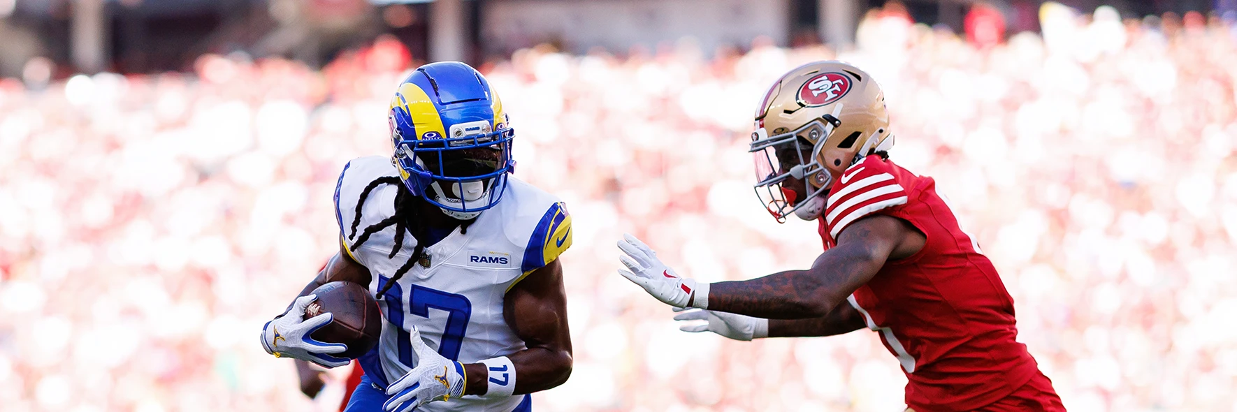 Players from the LA Rams and San Francisco 49ers playing an NFL match