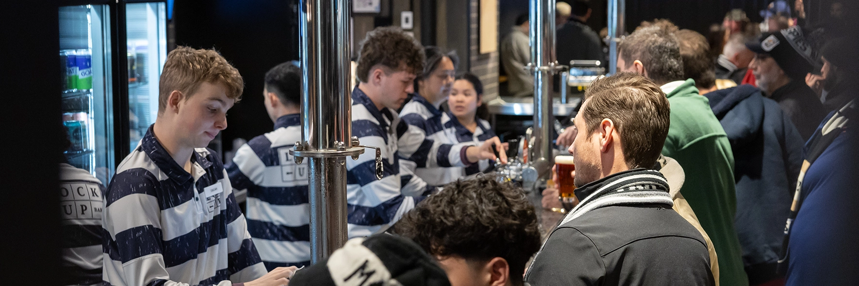 Fans line up to purchase drinks at the Lock Up Bar at the MCG