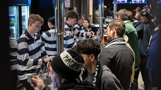 Fans line up to purchase drinks at the Lock Up Bar at the MCG