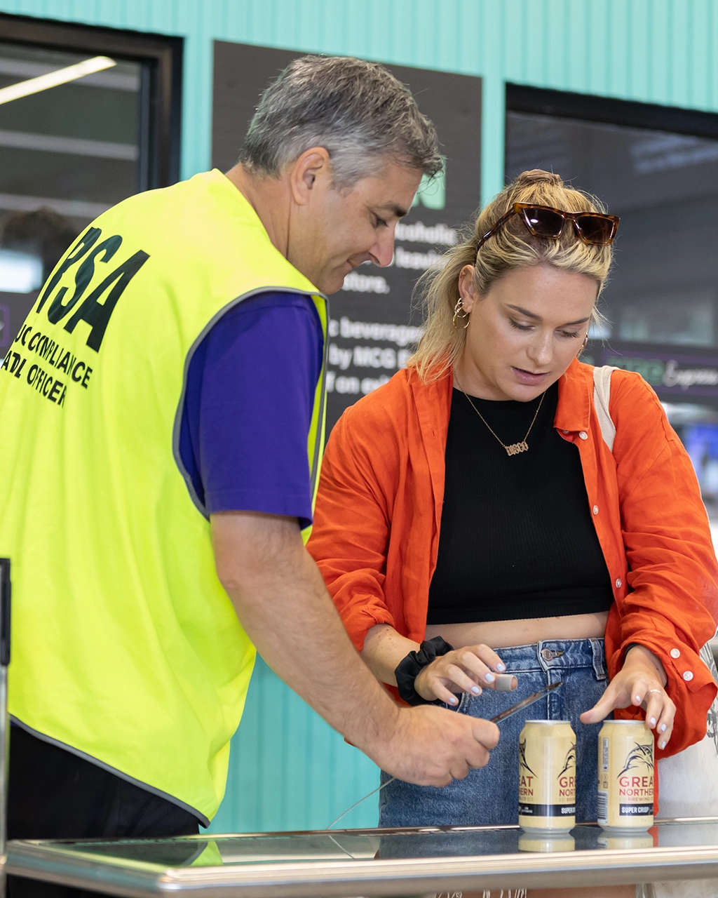 A Responsible Service of Alcohol officer assists a patron at the MCG A Responsible Service of Alcohol officer assists a patron at the MCG