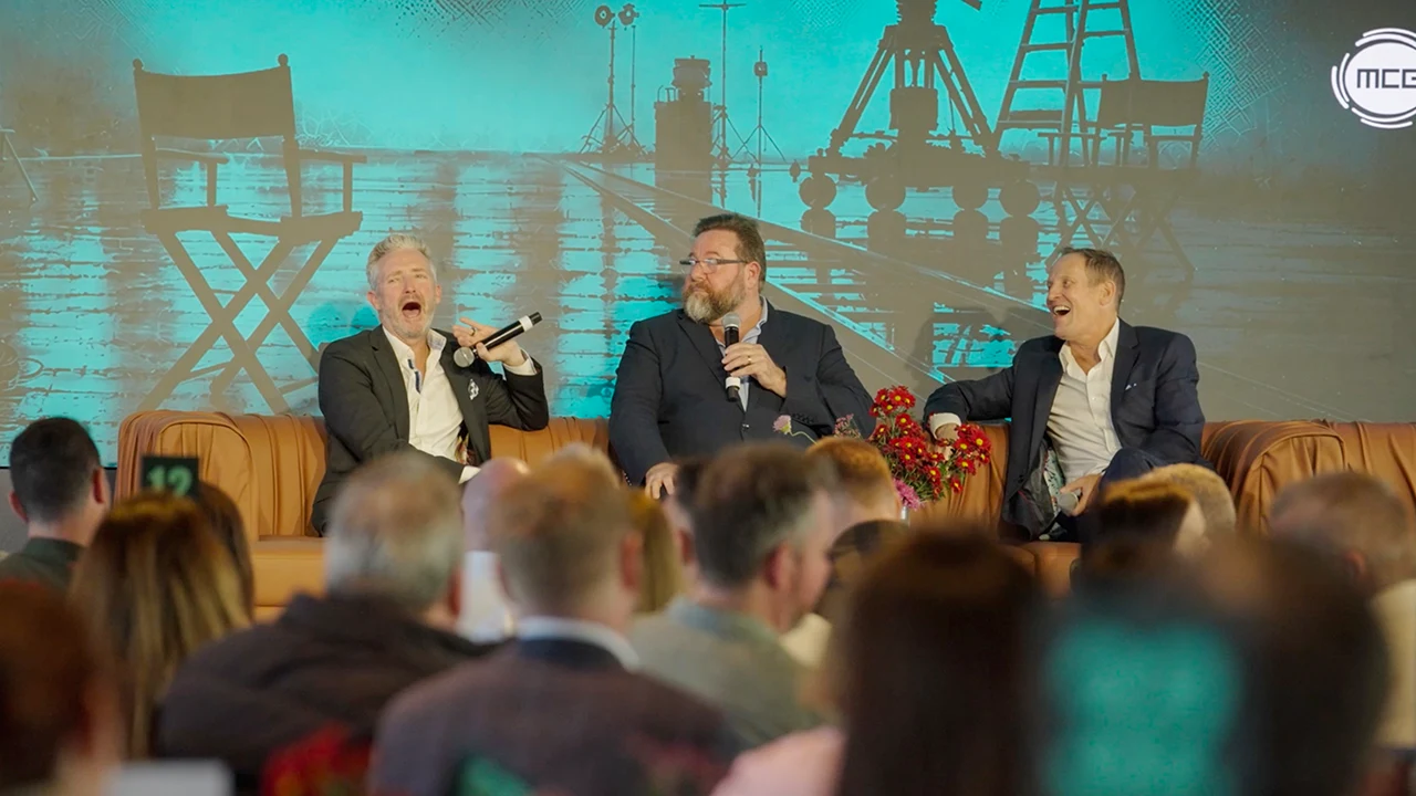 Actor and comedian Shane Jacobsen on stage at the MCG Network, quizzing Stephen Curry and Todd McKenney.