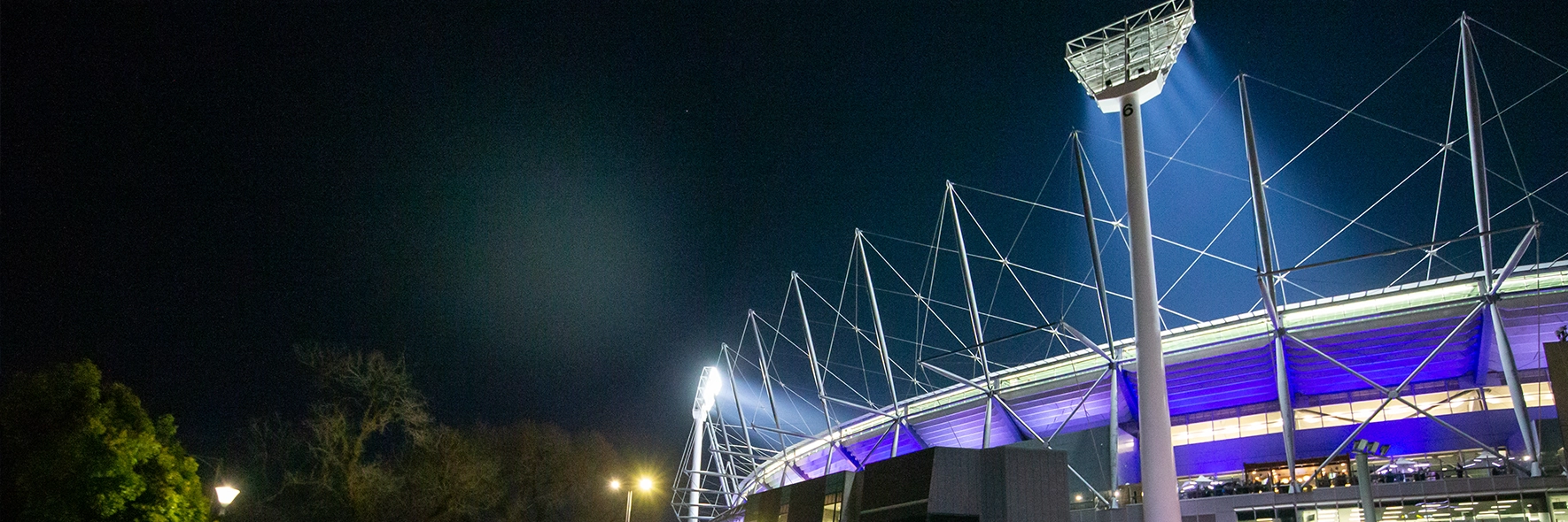 A view of the outside of the MCG lit up on a match night
