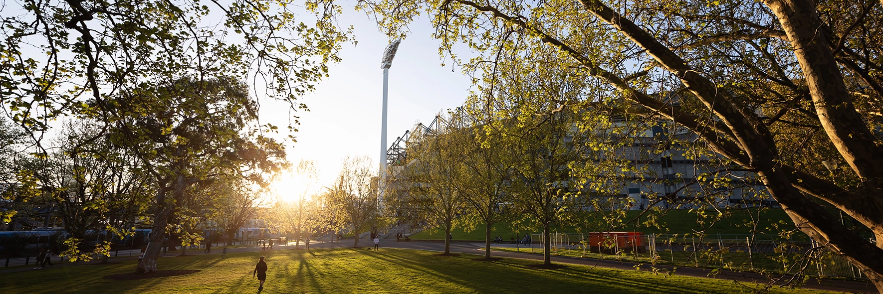A tree-lined view of Gate 1 of the MCG