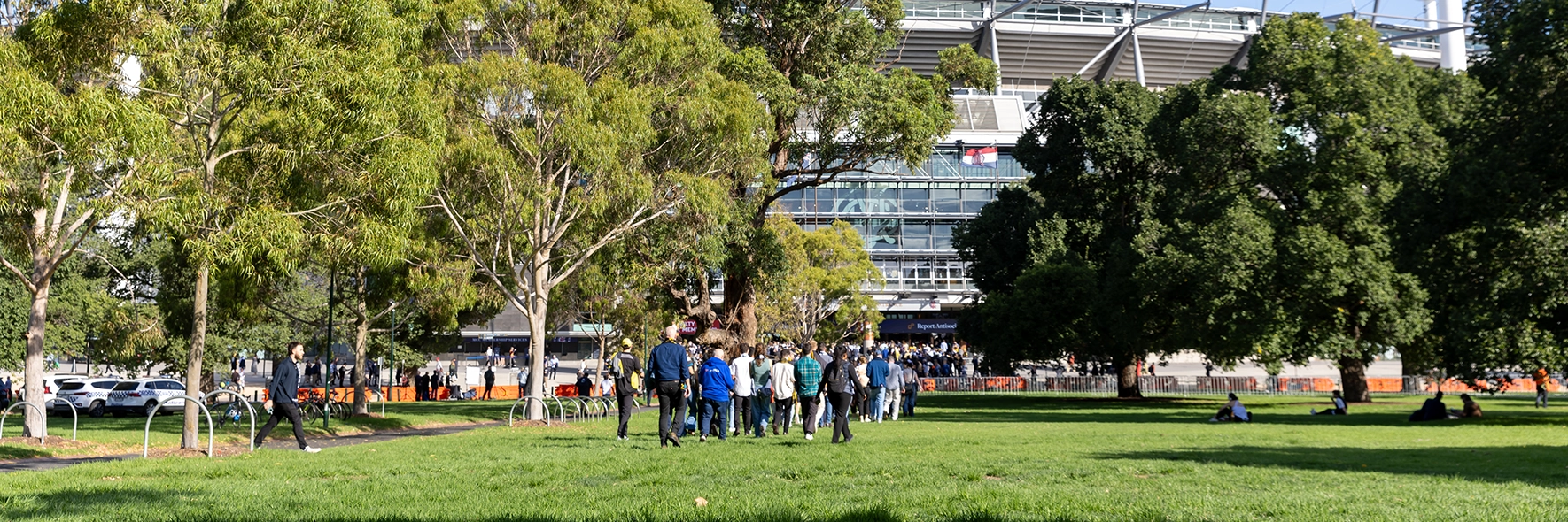 Patrons walk outside of the MCG