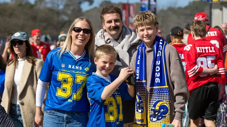 A family in Rams jerseys outside the MCG