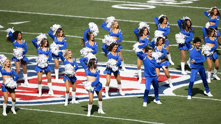 LA Rams cheerleaders performing on the NFL logo on the field