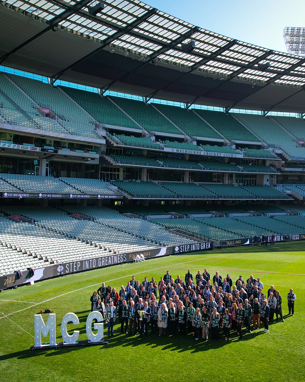 MCG permanent staff stand on the MCG arena