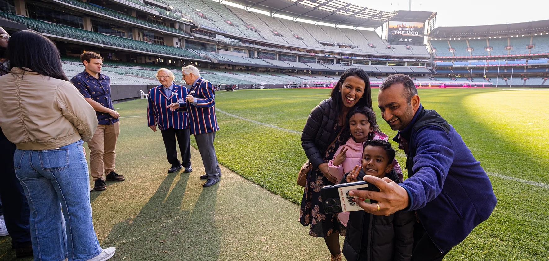 Tour group takes selfie on the MCG boundary line