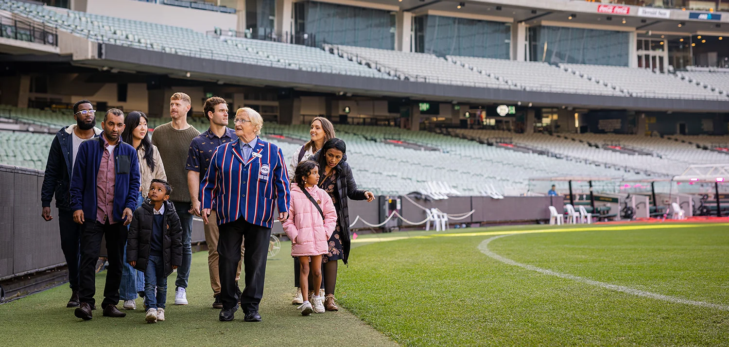 Tour group walks along MCG boundary line