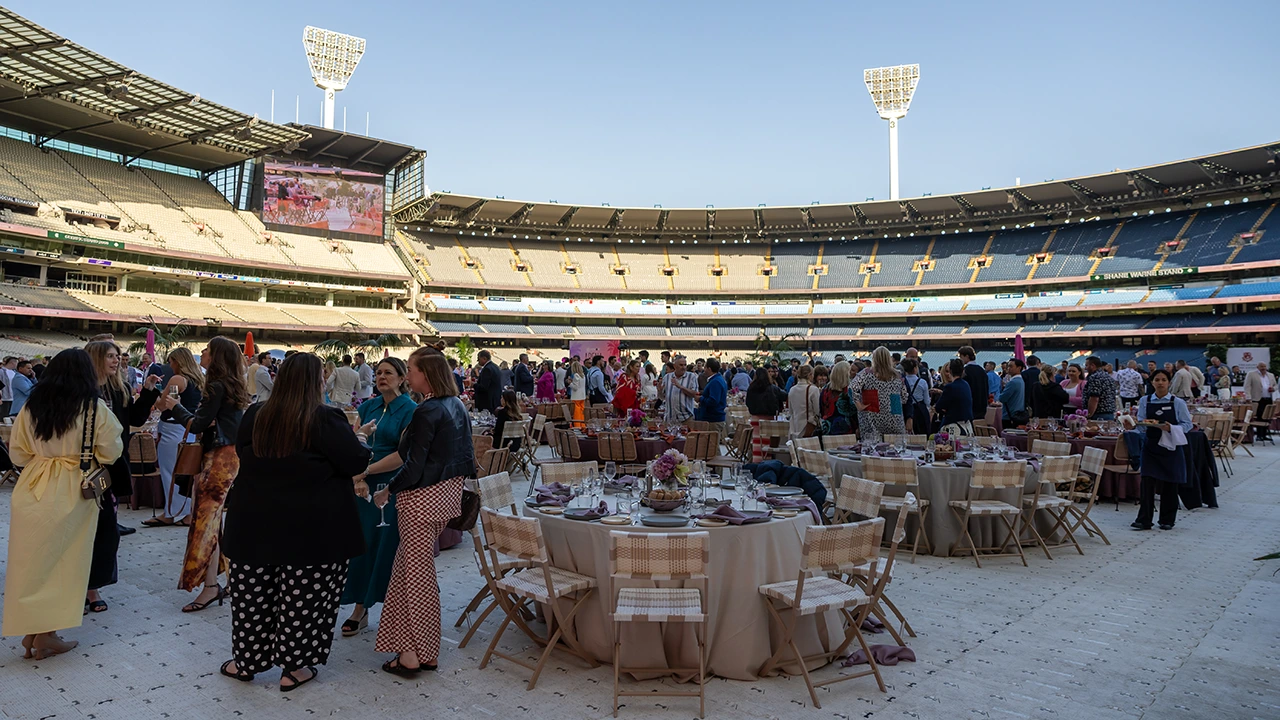 Guests mingle at a function on the MCG arena